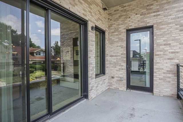 1030 17th Ave S Unit 201, Nashville, TN 37212 - view of exterior entry featuring brick siding