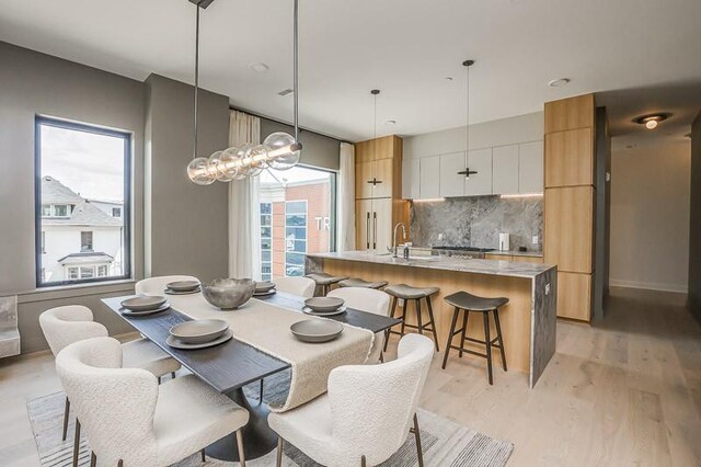 1030 17th Ave S Unit 201, Nashville, TN 37212 - dining space featuring light wood-style flooring