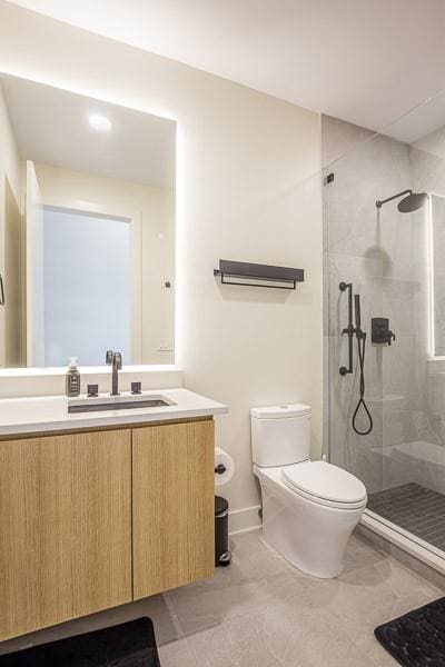 1030 17th Ave S Unit 201, Nashville, TN 37212 - full bath with toilet, a stall shower, and vanity