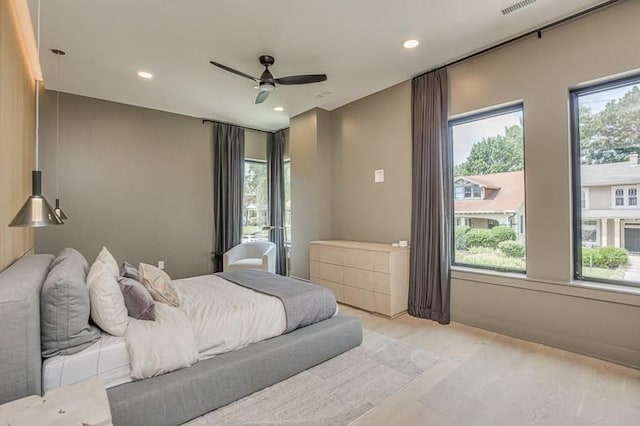 1030 17th Ave S Unit 201, Nashville, TN 37212 - bedroom with multiple windows, recessed lighting, ceiling fan, and light wood-style floors