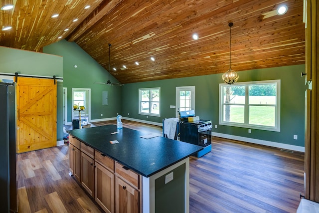 1474 Pea Ridge Rd, Manchester, TN 37355 - kitchen featuring dark countertops, gas range, open floor plan, wooden ceiling, and dark wood-type flooring