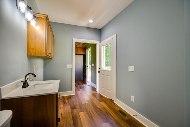 1474 Pea Ridge Rd, Manchester, TN 37355 - bathroom with toilet, wood finished floors, baseboards, recessed lighting, and vanity