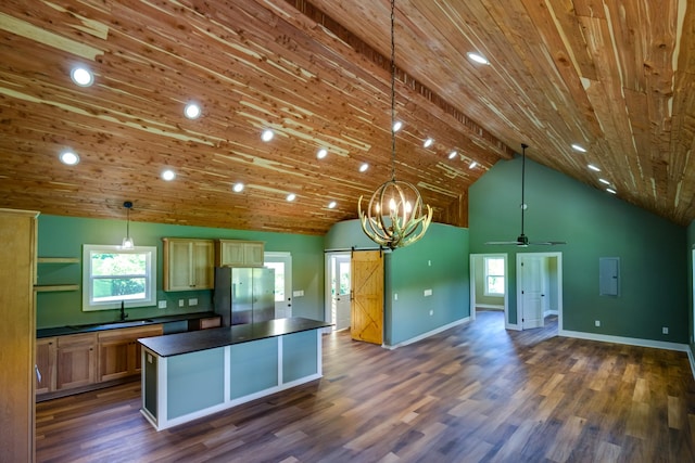 1474 Pea Ridge Rd, Manchester, TN 37355 - kitchen with freestanding refrigerator, a barn door, dark countertops, wooden ceiling, and open floor plan