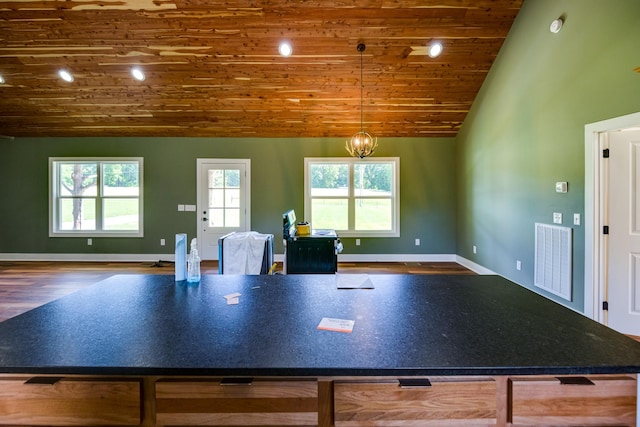 1474 Pea Ridge Rd, Manchester, TN 37355 - kitchen with wooden ceiling, wood finished floors, open floor plan, baseboards, and dark countertops