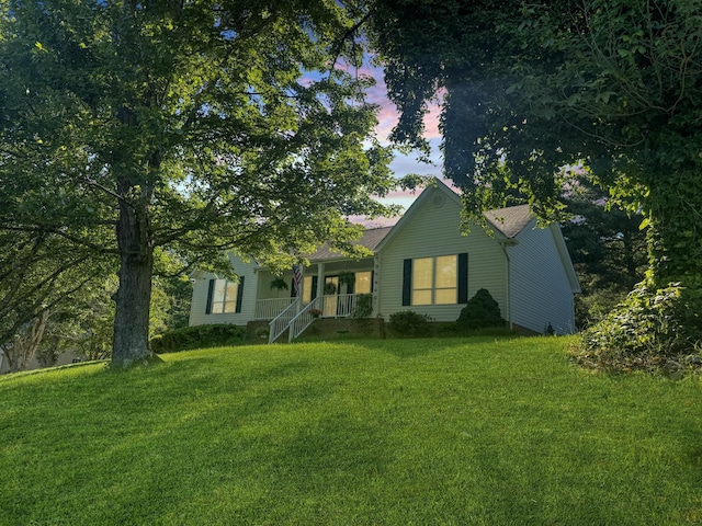 1219 Woodsage Dr, Soddy Daisy, TN 37379 - ranch-style home with a lawn and covered porch