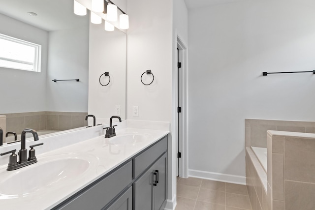 283 Subban Ct, Lebanon, TN 37087 - bathroom featuring a garden tub, double vanity, tile patterned floors, and baseboards