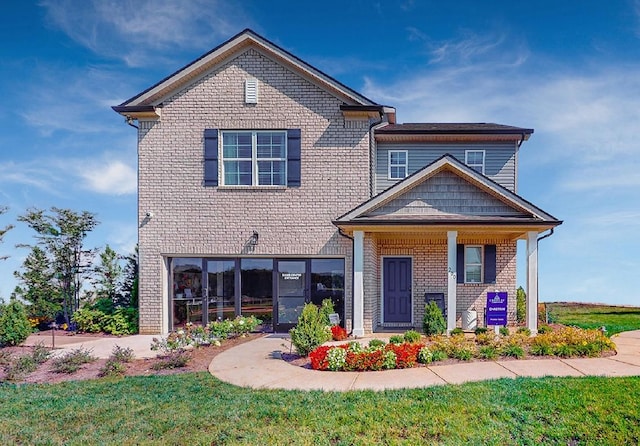 186 Millbrook Dr, Spring Hill, TN 37174 - traditional home with brick siding and a front yard