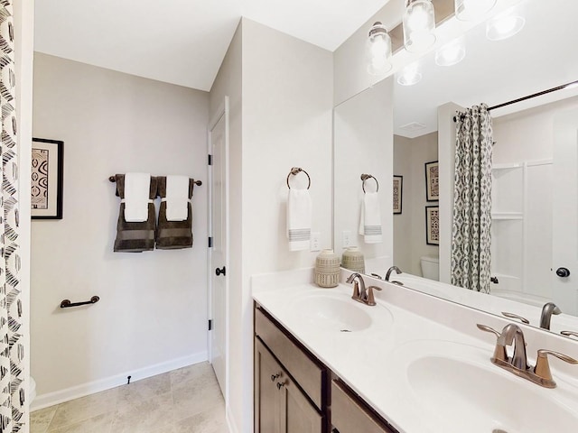 186 Millbrook Dr, Spring Hill, TN 37174 - bathroom with toilet, double vanity, and baseboards