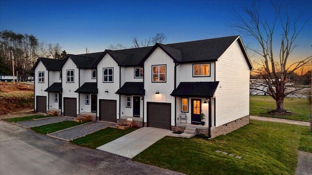 3670 Main St Unit 1, Jasper, TN 37347 - modern farmhouse style home with concrete driveway, a garage, board and batten siding, and a lawn
