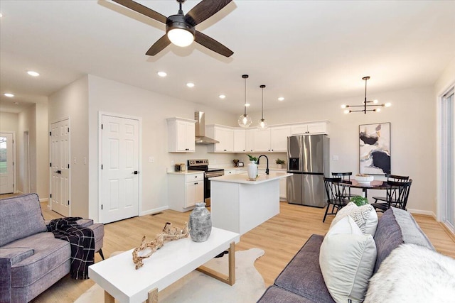 3670 Main St Unit 1, Jasper, TN 37347 - living room with light wood-style floors, recessed lighting, ceiling fan, a chandelier, and baseboards