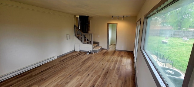 2000 Hickory Hill Ln, Hermitage, TN 37076 - entryway with a baseboard radiator, rail lighting, light wood finished floors, stairway, and baseboards