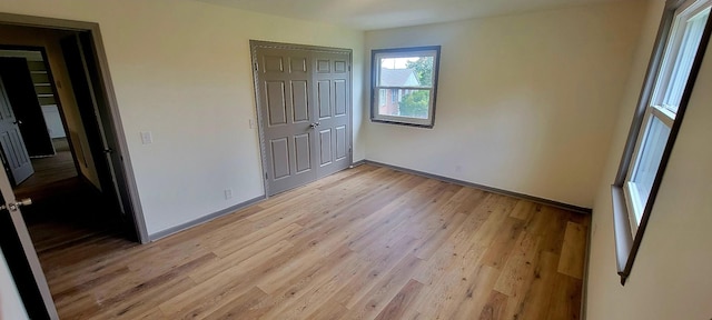 2000 Hickory Hill Ln, Hermitage, TN 37076 - unfurnished bedroom featuring light wood-style floors, baseboards, and a closet