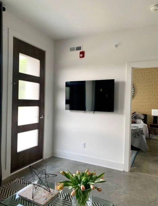 2521 Clifton Ave Unit 101, Nashville, TN 37209 - foyer featuring concrete flooring and baseboards