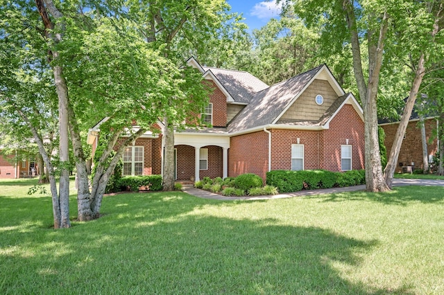 2220 Oakside Ct, Murfreesboro, TN 37128 - traditional-style house featuring brick siding, a front lawn, and roof with shingles