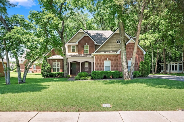 2220 Oakside Ct, Murfreesboro, TN 37128 - view of front of home with a front yard, brick siding, and roof with shingles