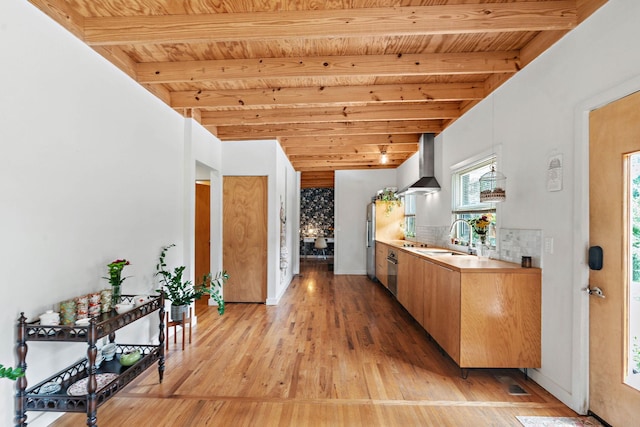 4303 Burrus St, Nashville, TN 37216 - kitchen featuring wall chimney range hood, wooden ceiling with exposed beams, a sink, light wood-style flooring, and light countertops