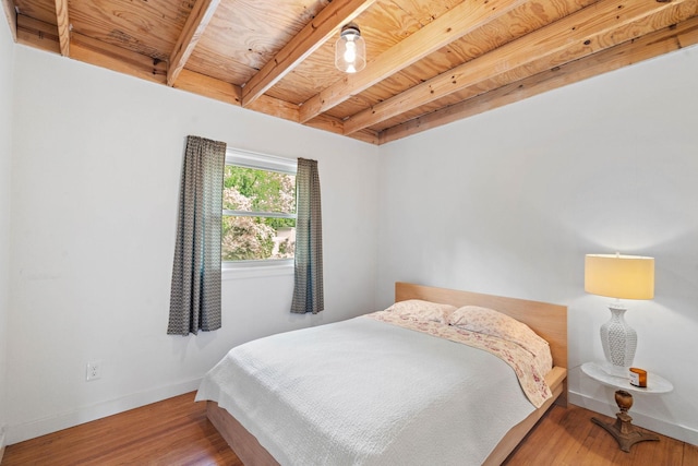 4303 Burrus St, Nashville, TN 37216 - bedroom featuring baseboards, wooden ceiling with exposed beams, and wood finished floors