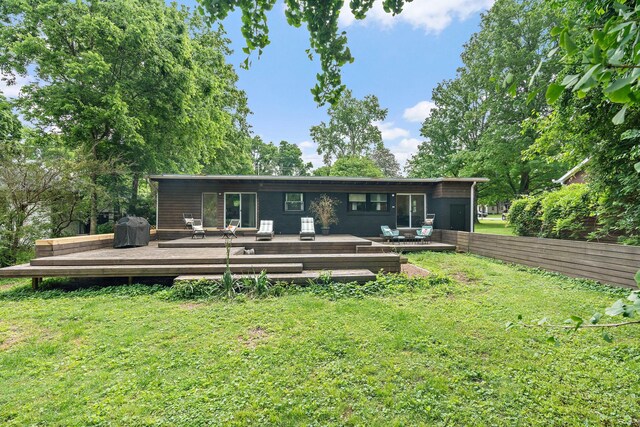 4303 Burrus St, Nashville, TN 37216 - back of property with a yard and a wooden deck