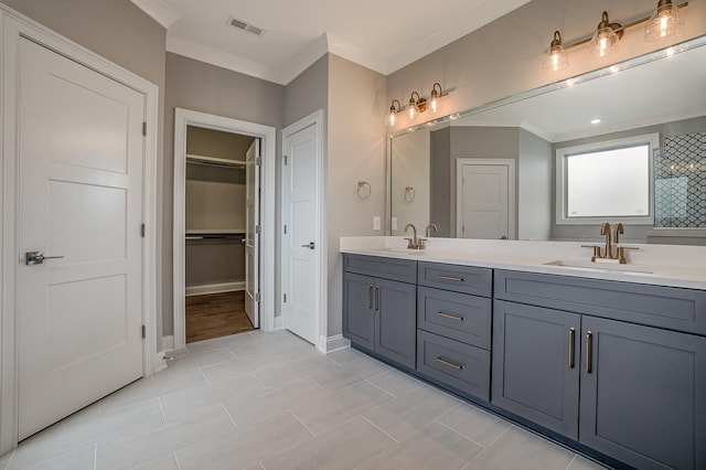 5405 Manners Rd, Lebanon, TN 37087 - bathroom with double vanity, ornamental molding, a spacious closet, and baseboards