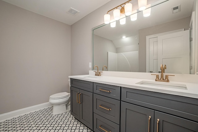 5405 Manners Rd, Lebanon, TN 37087 - bathroom with double vanity, toilet, and baseboards