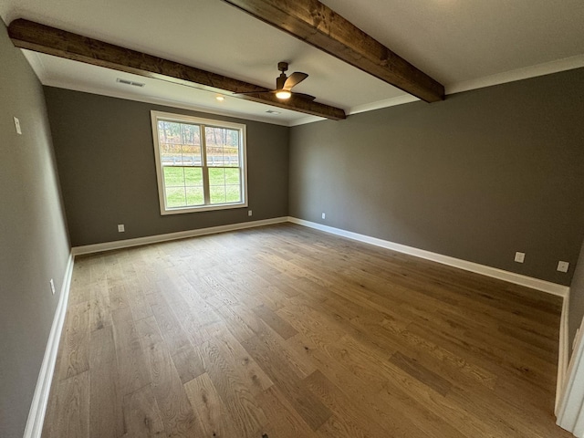 5405 Manners Rd, Lebanon, TN 37087 - empty room with wood finished floors, ceiling fan, beamed ceiling, and baseboards