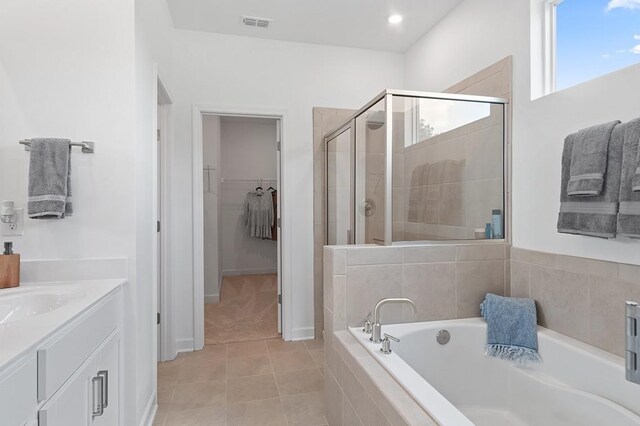 2506 Beverly Gail Rd, Pleasant View, TN 37146 - full bathroom with a stall shower, a bath, a walk in closet, vanity, and tile patterned floors