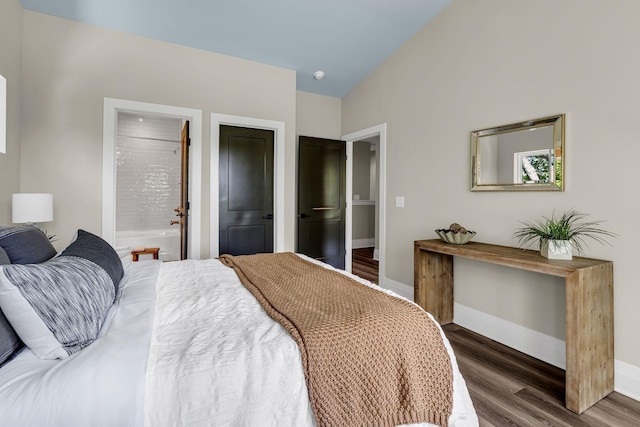 1004 Noble Loop Unit 49, Nashville, TN 37211 - bedroom featuring dark wood-style floors, baseboards, and connected bathroom