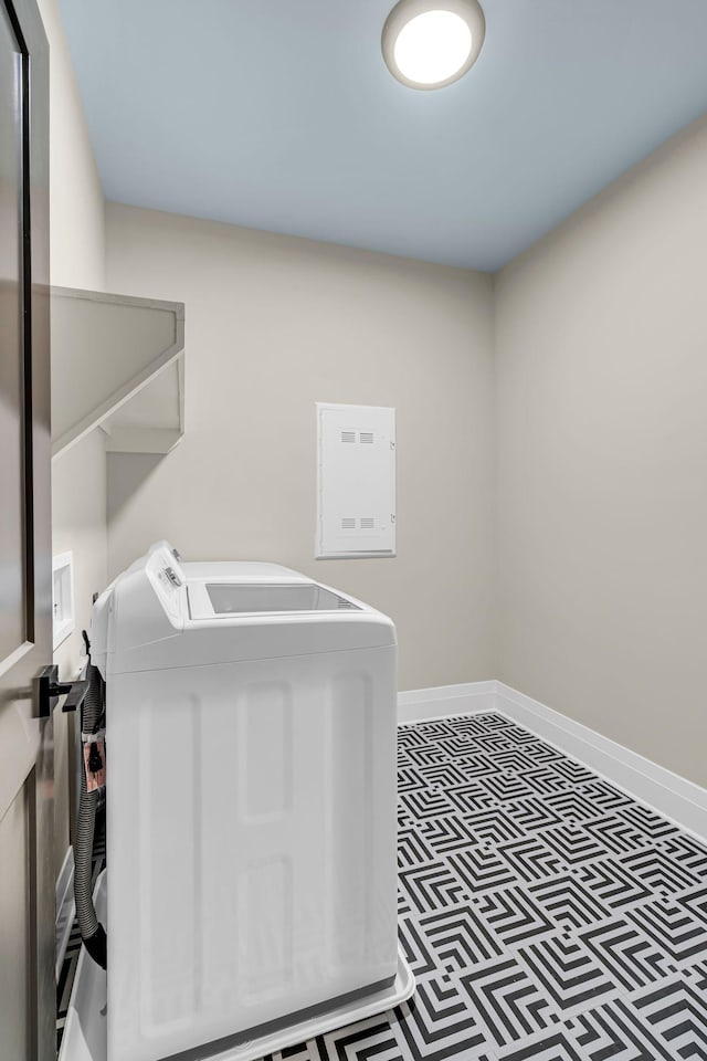 1004 Noble Loop Unit 49, Nashville, TN 37211 - laundry area featuring washing machine and dryer, electric panel, baseboards, and tile patterned floors