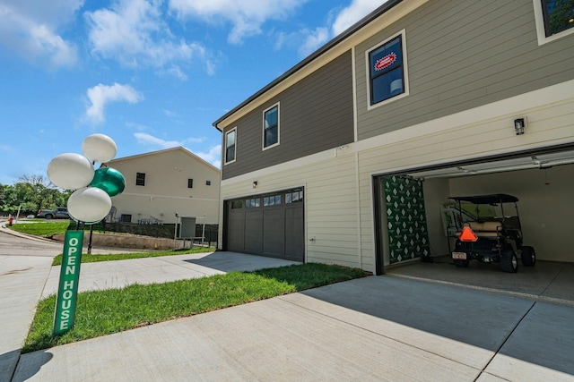 1004 Noble Loop Unit 49, Nashville, TN 37211 - view of home's exterior with a garage and concrete driveway