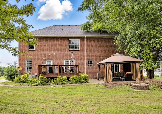 3198 Gray Hawk Ct, Clarksville, TN 37043 - rear view of house featuring a gazebo, a yard, a wooden deck, brick siding, and an outdoor living space with a fire pit