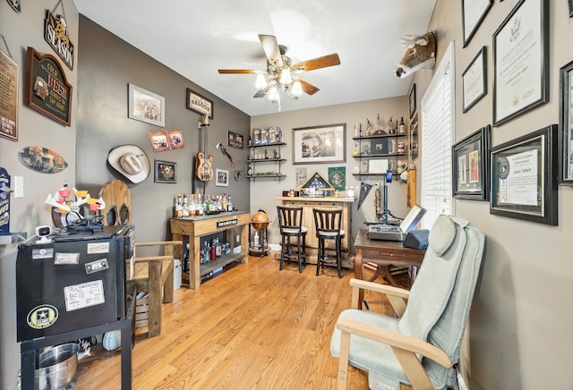 3198 Gray Hawk Ct, Clarksville, TN 37043 - home office featuring ceiling fan, wood finished floors, and a dry bar