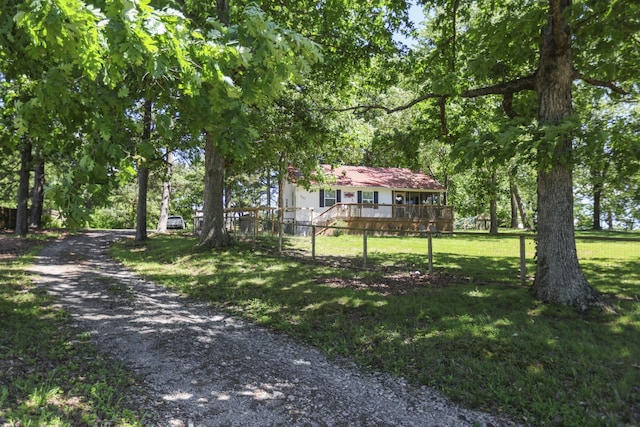 1602 Pleasant Grove Rd, Westmoreland, TN 37186 - view of front facade featuring a wooden deck and a front yard