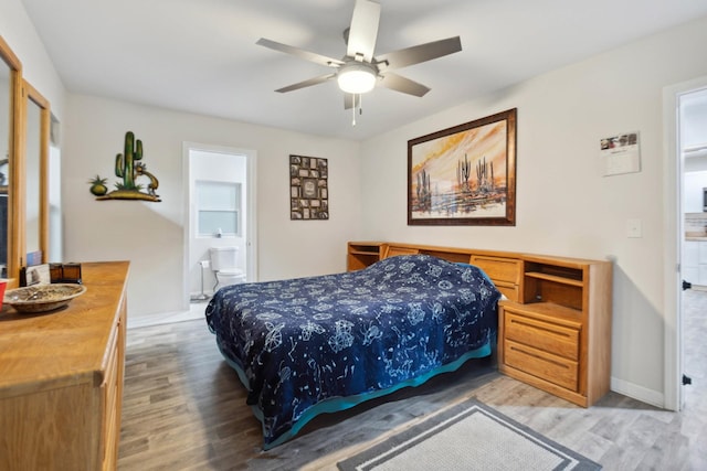 1602 Pleasant Grove Rd, Westmoreland, TN 37186 - bedroom featuring light wood-style flooring, baseboards, ensuite bath, and ceiling fan