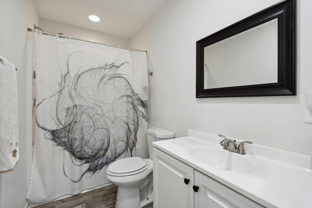 1602 Pleasant Grove Rd, Westmoreland, TN 37186 - full bath with vanity, toilet, wood finished floors, a shower with shower curtain, and recessed lighting
