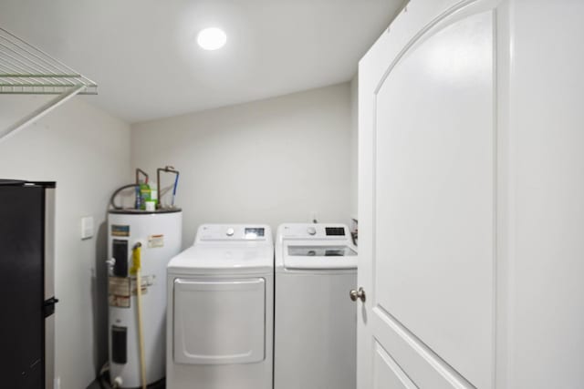 1602 Pleasant Grove Rd, Westmoreland, TN 37186 - laundry room with water heater and washing machine and clothes dryer
