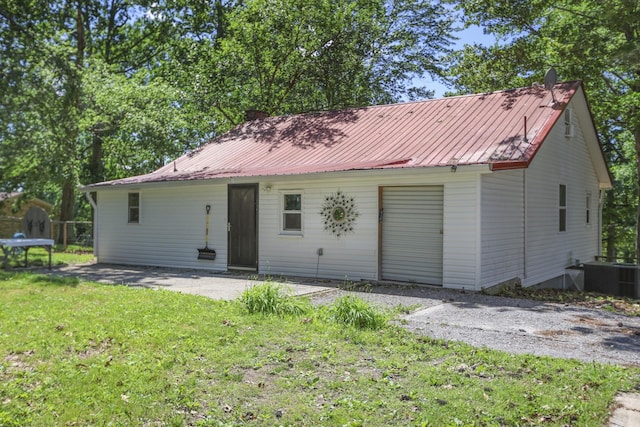 1602 Pleasant Grove Rd, Westmoreland, TN 37186 - rear view of house featuring metal roof and central air condition unit
