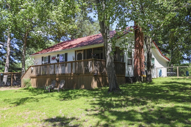 1602 Pleasant Grove Rd, Westmoreland, TN 37186 - back of house featuring a chimney, a wooden deck, and metal roof