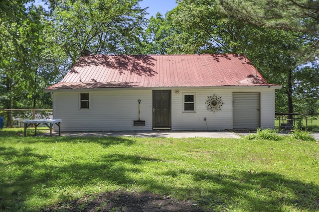 1602 Pleasant Grove Rd, Westmoreland, TN 37186 - rear view of house featuring a patio, a yard, and metal roof