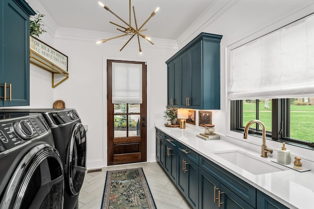 505 Green Apple Turn, Brentwood, TN 37027 - laundry area featuring cabinet space, washing machine and clothes dryer, and a chandelier