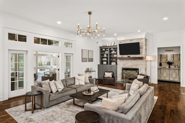 505 Green Apple Turn, Brentwood, TN 37027 - living room with ornamental molding, a chandelier, dark wood-style flooring, a stone fireplace, and recessed lighting
