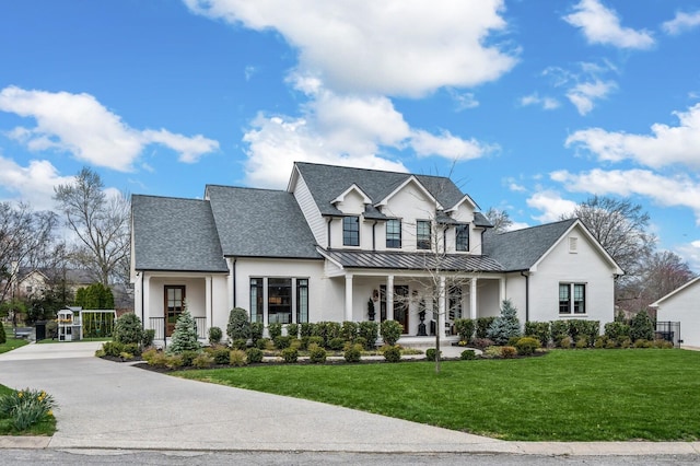 505 Green Apple Turn, Brentwood, TN 37027 - view of front of house featuring a porch, a standing seam roof, a front lawn, stucco siding, and roof with shingles