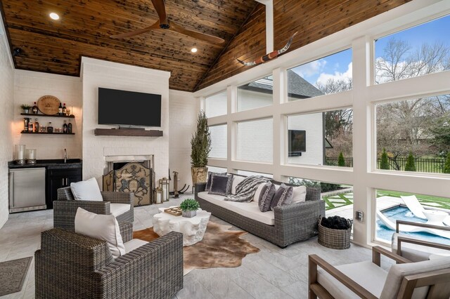 505 Green Apple Turn, Brentwood, TN 37027 - living room with high vaulted ceiling, wood ceiling with exposed beams, healthy amount of natural light, a ceiling fan, and bar area