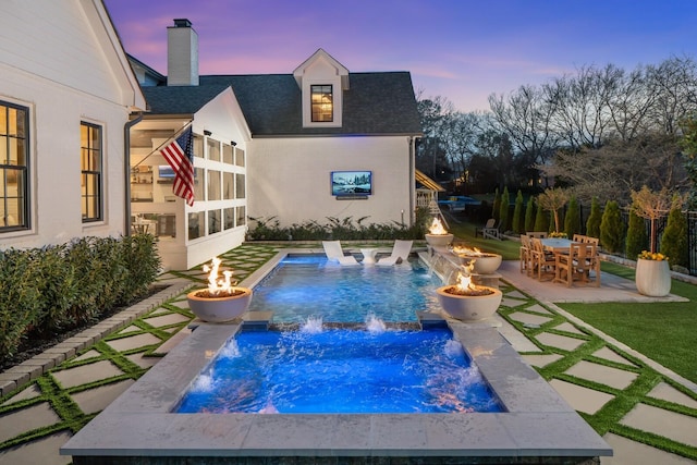 505 Green Apple Turn, Brentwood, TN 37027 - pool at dusk featuring an outdoor fire pit, an outdoor hot tub, an outdoor pool, and a patio