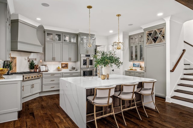 505 Green Apple Turn, Brentwood, TN 37027 - kitchen with gray cabinets, stainless steel appliances, premium range hood, glass insert cabinets, and recessed lighting
