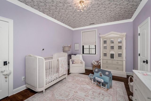 505 Green Apple Turn, Brentwood, TN 37027 - bedroom with wood finished floors, baseboards, a nursery area, and crown molding