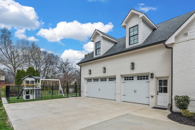 505 Green Apple Turn, Brentwood, TN 37027 - view of property exterior featuring concrete driveway, a playground, roof with shingles, and brick siding