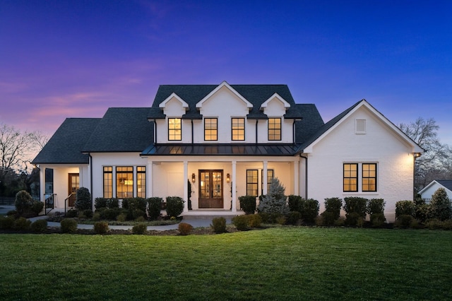 505 Green Apple Turn, Brentwood, TN 37027 - back of house at dusk with covered porch, a standing seam roof, a yard, and french doors