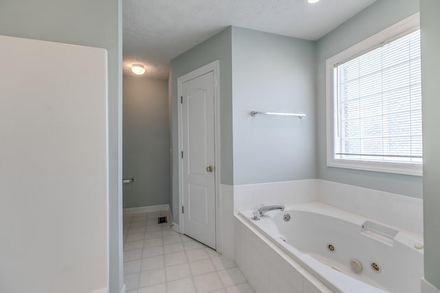 206 Sayre Ln, Murfreesboro, TN 37127 - full bathroom with a whirlpool tub, tile patterned flooring, a textured ceiling, and baseboards
