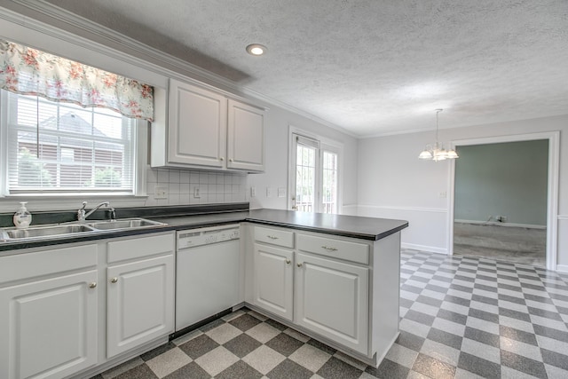 206 Sayre Ln, Murfreesboro, TN 37127 - kitchen featuring white dishwasher, tile patterned floors, ornamental molding, dark countertops, and a peninsula