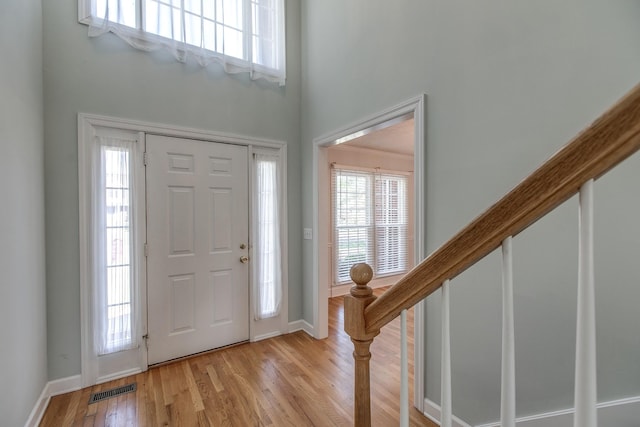 206 Sayre Ln, Murfreesboro, TN 37127 - entryway with a high ceiling, light wood-style flooring, stairway, and baseboards
